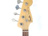 the neck of an electric bass guitar with a white background