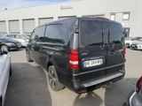 a black van that is parked in a parking lot