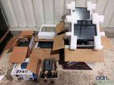 a pile of electronic equipment that is sitting on the floor