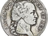 une pièce d'argent portant une tête de femme