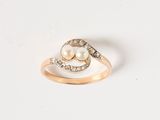 an image of a pearl and diamond ring on a white surface