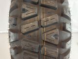 a close up of a motorcycle tire on a white surface