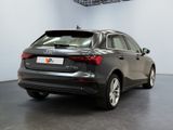 the rear end of a grey audi vehicle parked in a garage
