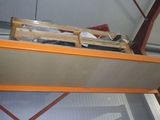 an overhead view of a room with a metal shelf and a mirror