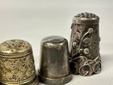 three thimbles sitting next to each other on a table