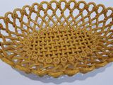 yellow wicker basket with handles on a white background