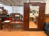 a room filled with furniture and a mirror on the wall