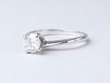 an image of a diamond ring on a white surface