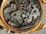 a close up of a watch that is on a table