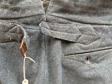 a close up of a person ' s pants with a tag on it