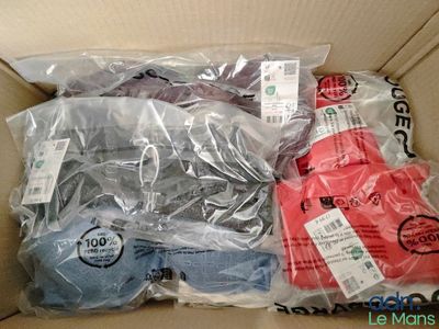 a cardboard box filled with assorted items for sale