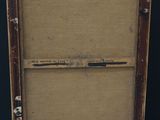 an old wooden easel with a painting on top of it