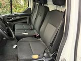 a white van with black seats in the back of it