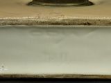 a close up view of a white plate on a table