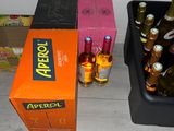 many bottles of beer sitting on the floor next to each other