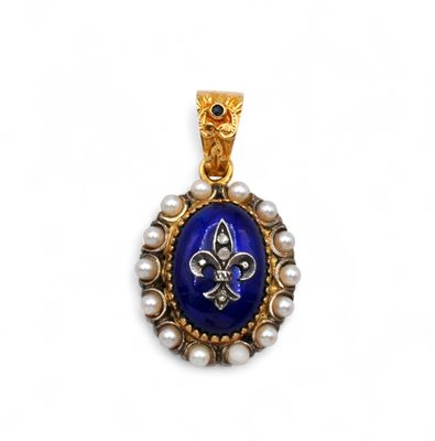 a close up of a gold and blue pendant with pearls