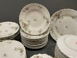 a lot of plates that are sitting on a table