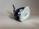 a small blue and white bird figurine sitting on a table