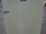 a white refrigerator that is sitting on the floor