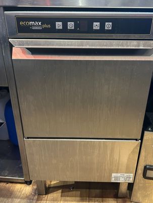 an image of a stainless steel dishwasher sitting on top of a wooden floor