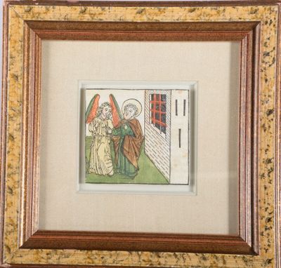 a framed picture of an angel and a woman standing in front of a building