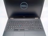 the dell laptop is open and ready to be used