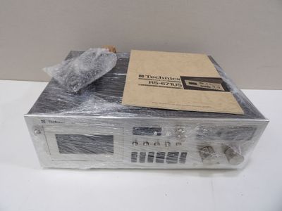 a radio sitting on top of a box wrapped in plastic