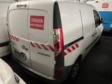 a white van that is parked in a parking lot