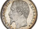 a close up of a coin with a man ' s face on it