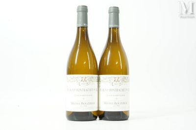 two bottles of wine sitting next to each other on a table