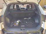 the back of a car with a bunch of wires in the trunk