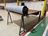 a roll of paper sitting on a table in a warehouse