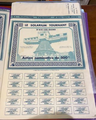 a lot of pamphlets on a table with a picture of a windmill