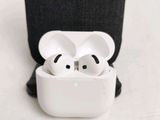 two airpods sitting in a case on a table