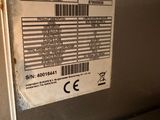 a label on the back of a machine that has a barcode on it
