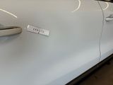 a white car with a sticker on the side of it