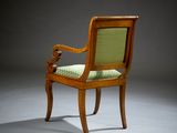 an image of a chair with a green upholstered seat