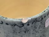 a close up of a cup of tea on a table