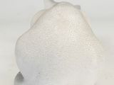 a white object that is sitting on a white surface
