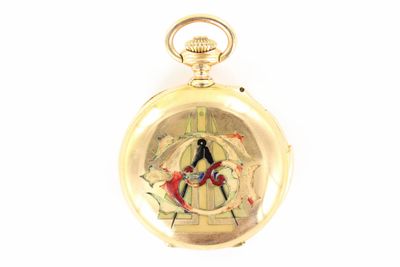 a gold pocket watch with a picture of a man and a woman on it