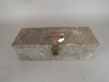 an old metal box with a key on it