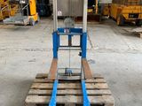 a close up of a fork lifter in a warehouse