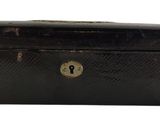 an old black suitcase with a lock on it