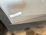 a sticker on the door of a white car