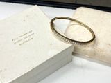 a white box with a ring on it and a white box with a ring on it