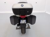 a black and white motorcycle parked in a white room