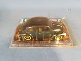 a plastic box with a toy car inside of it