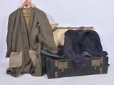 a suit case with a coat and a jacket in it