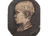 portrait of a young man in a black and gold frame