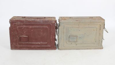 pair of old tin cans with lids and handles